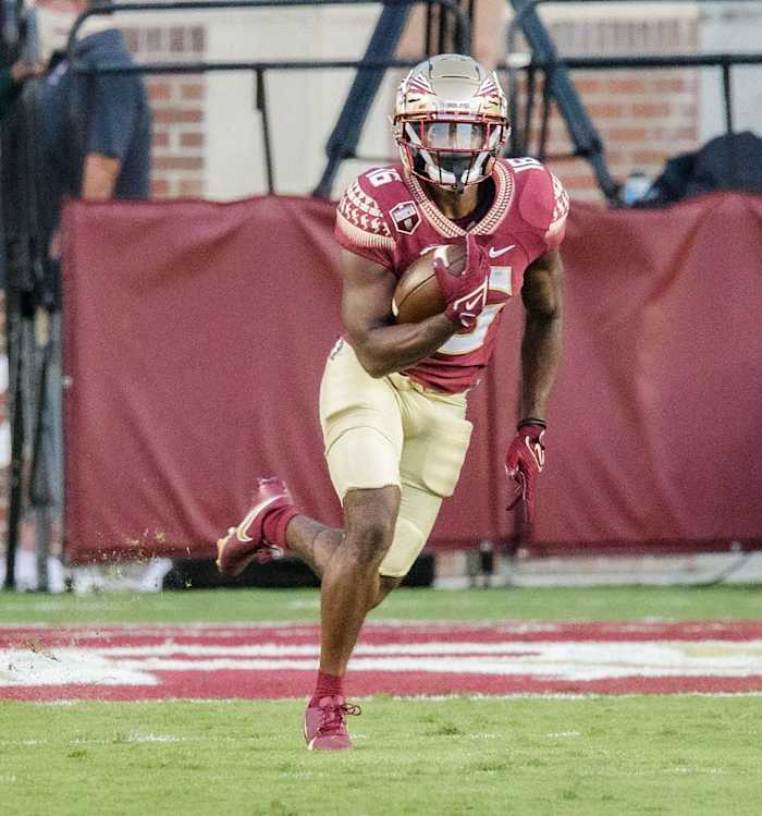 Florida State Seminoles running back Corey Wren (16) runs the ball down the field. The Notre Dame Fighting Irish lead the Florida State Seminoles 17-14 at the half Sunday, Sept. 5, 2021.